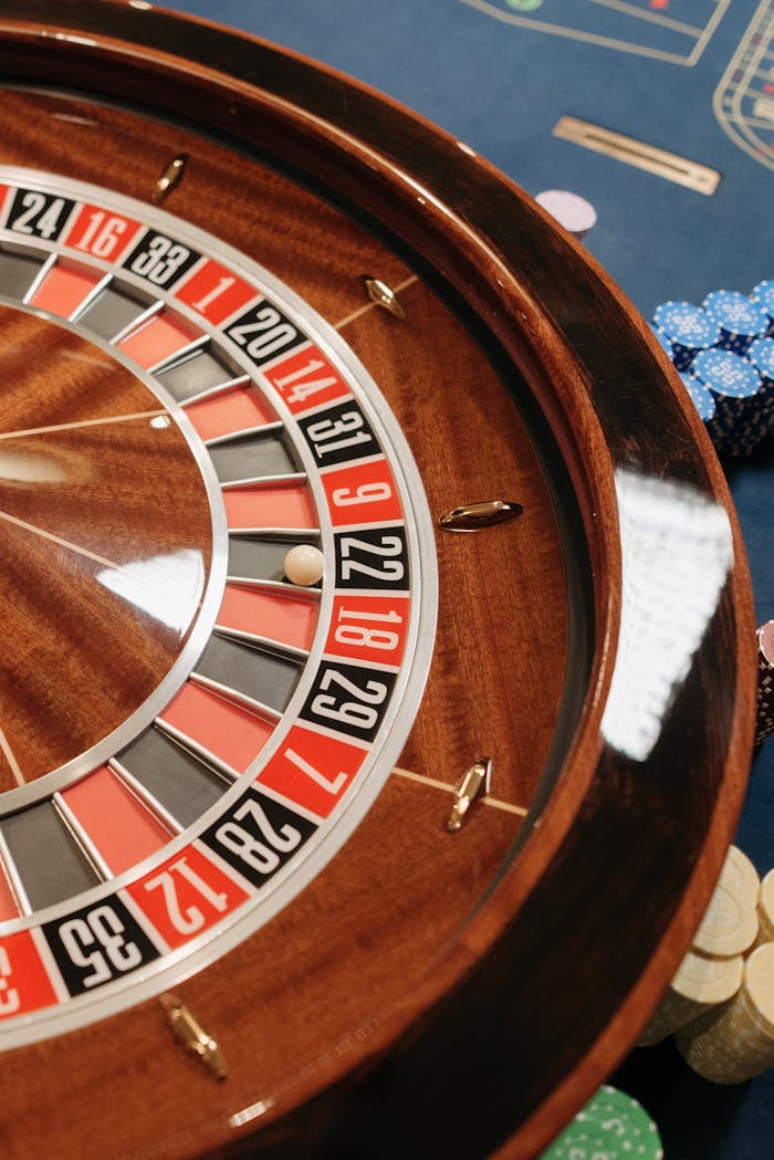 services-02 Close-up of a roulette wheel with poker chips in a casino setting, highlighting chance and gambling.