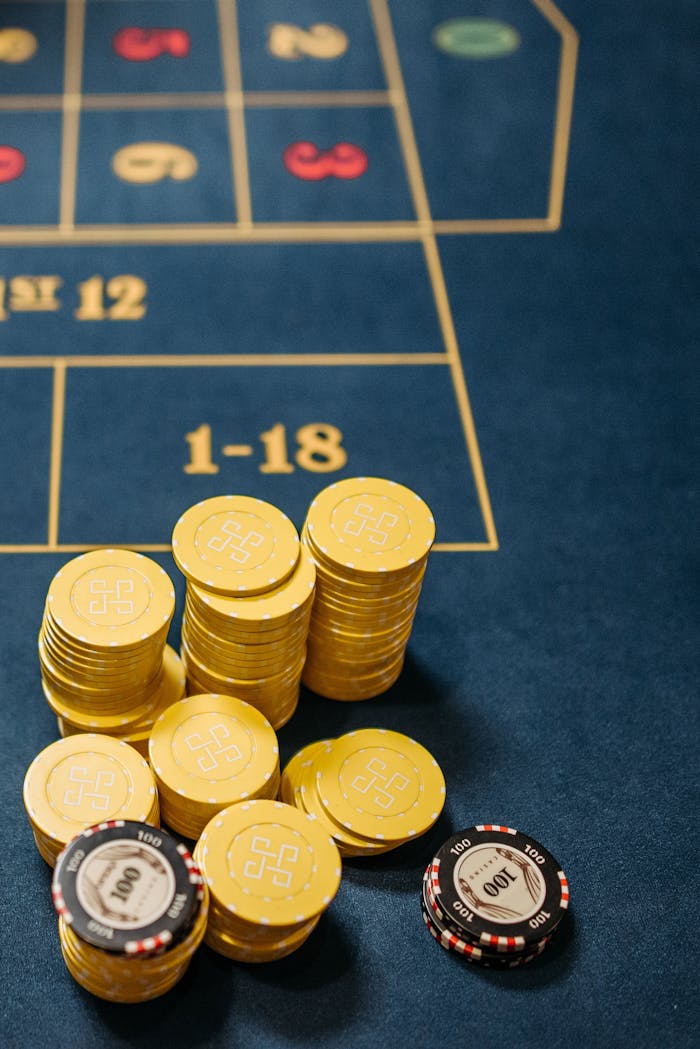who-we-are Gambling chips stacked on a roulette table, emphasizing chance and luck in gaming.